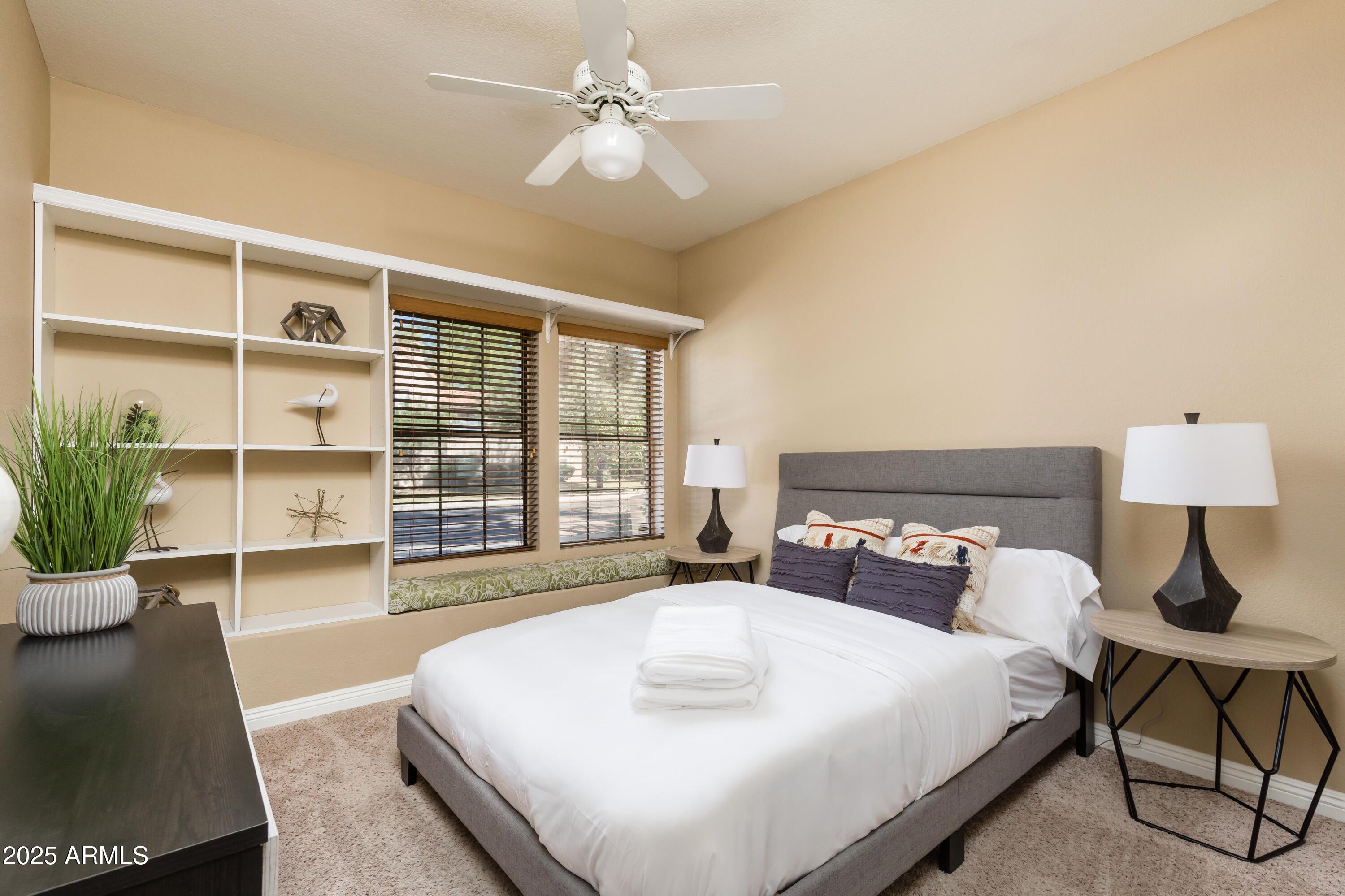 5821 East Aire Libre Avenue Scottsdale, AZ 85254 - Photo 22 of 35 a bedroom with a large bed and a window