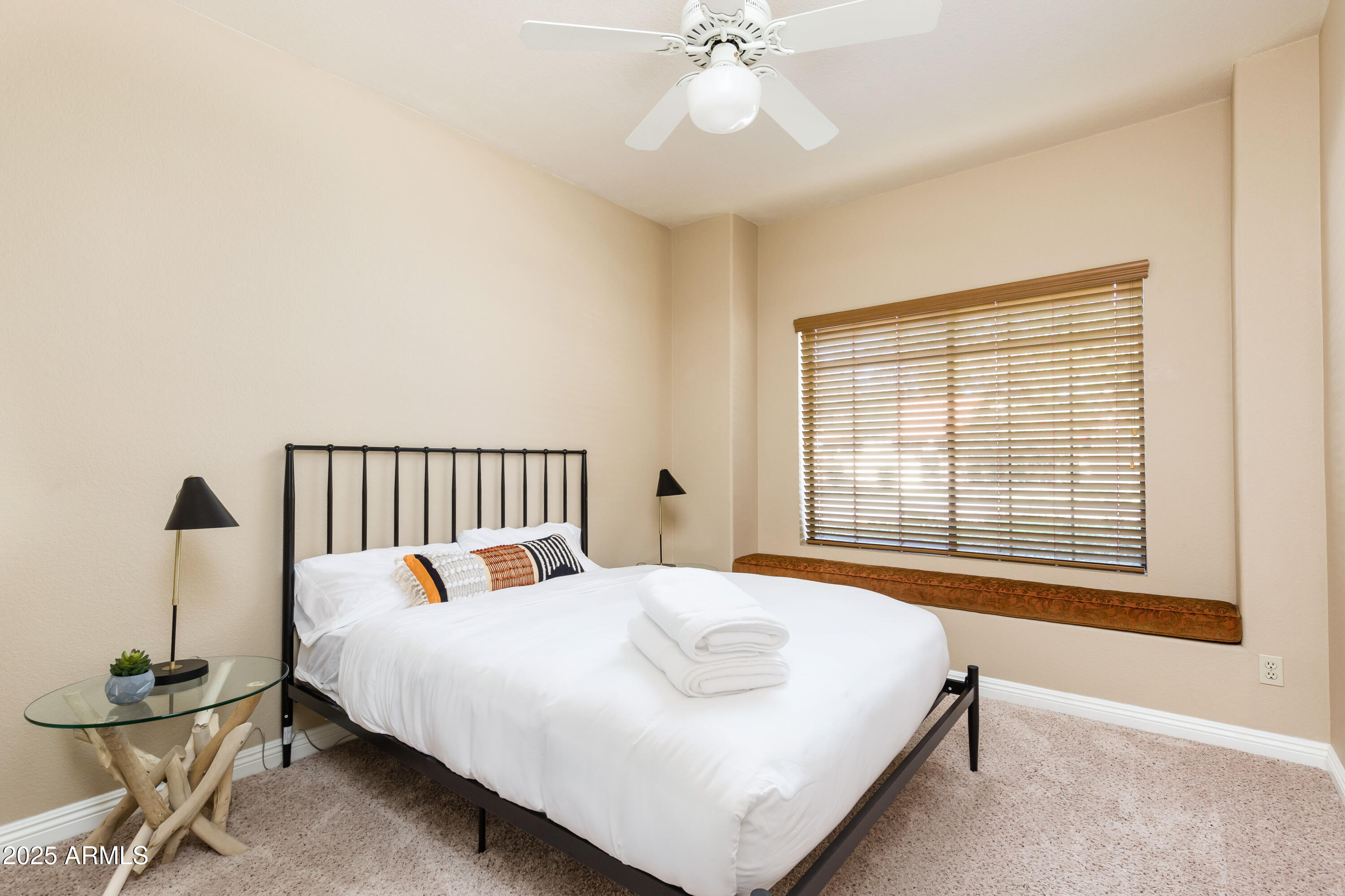 5821 East Aire Libre Avenue Scottsdale, AZ 85254 - Photo 29 of 35 a bedroom with a bed and chair
