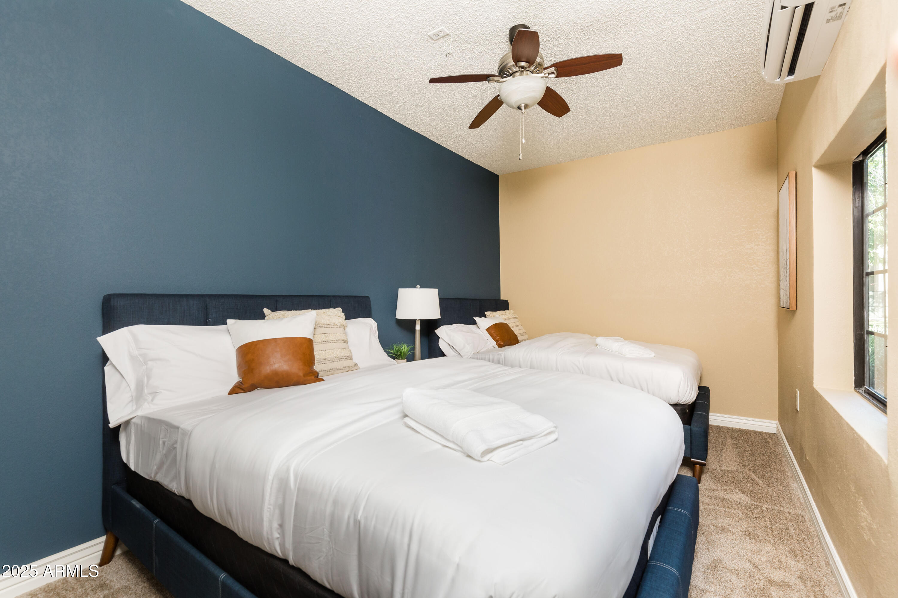 5821 East Aire Libre Avenue Scottsdale, AZ 85254 - Photo 30 of 35 a bedroom with bed and window