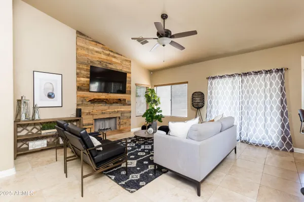 a living room with furniture and a fireplace