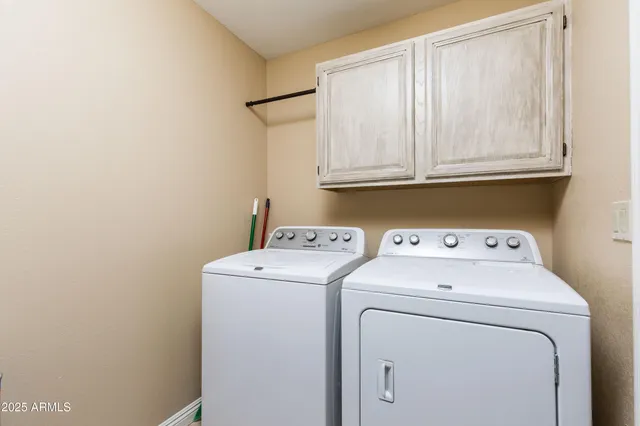 a view of storage room with washer and dryer