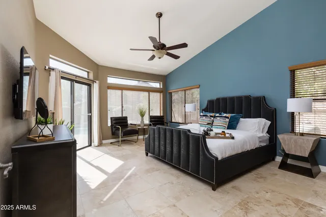 a bed room with a bed and a chandelier