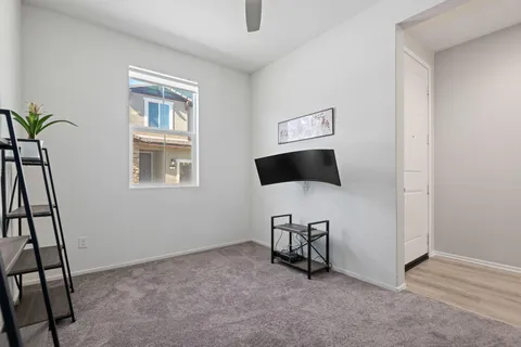 a bathroom with a sink mirror and toilet