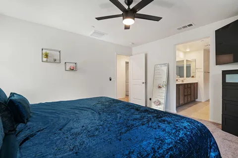 a spacious bathroom with a shower sink double and mirror