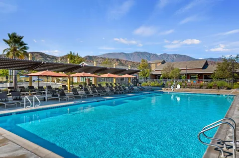 a view of a swimming pool with a lounge chairs