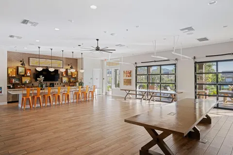a view of a dining room with furniture wooden floor and chandelier
