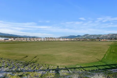 a view of an outdoor space and tennis court