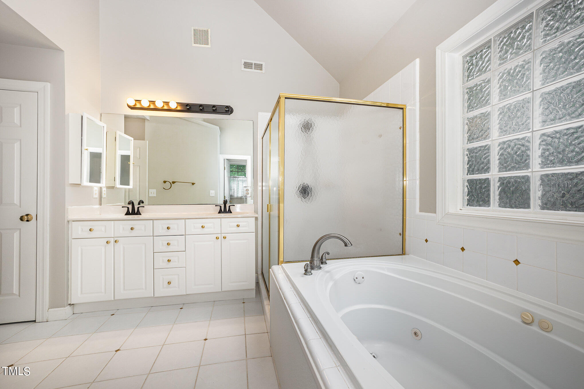 9400 Floral Ridge Court Raleigh, NC 27613 - Photo 15 of 35 a bathroom with a granite countertop sink a toilet and shower