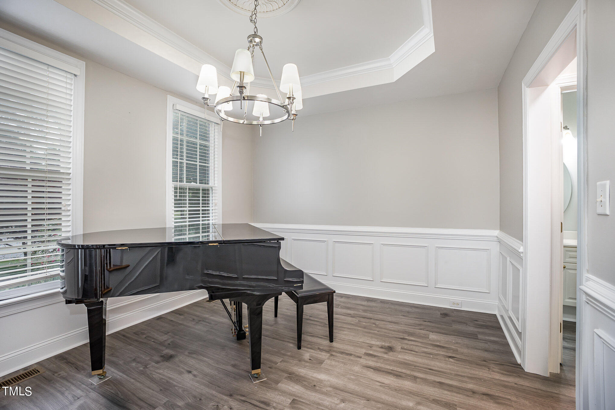 9400 Floral Ridge Court Raleigh, NC 27613 - Photo 19 of 35 a living room with wooden floor and a window