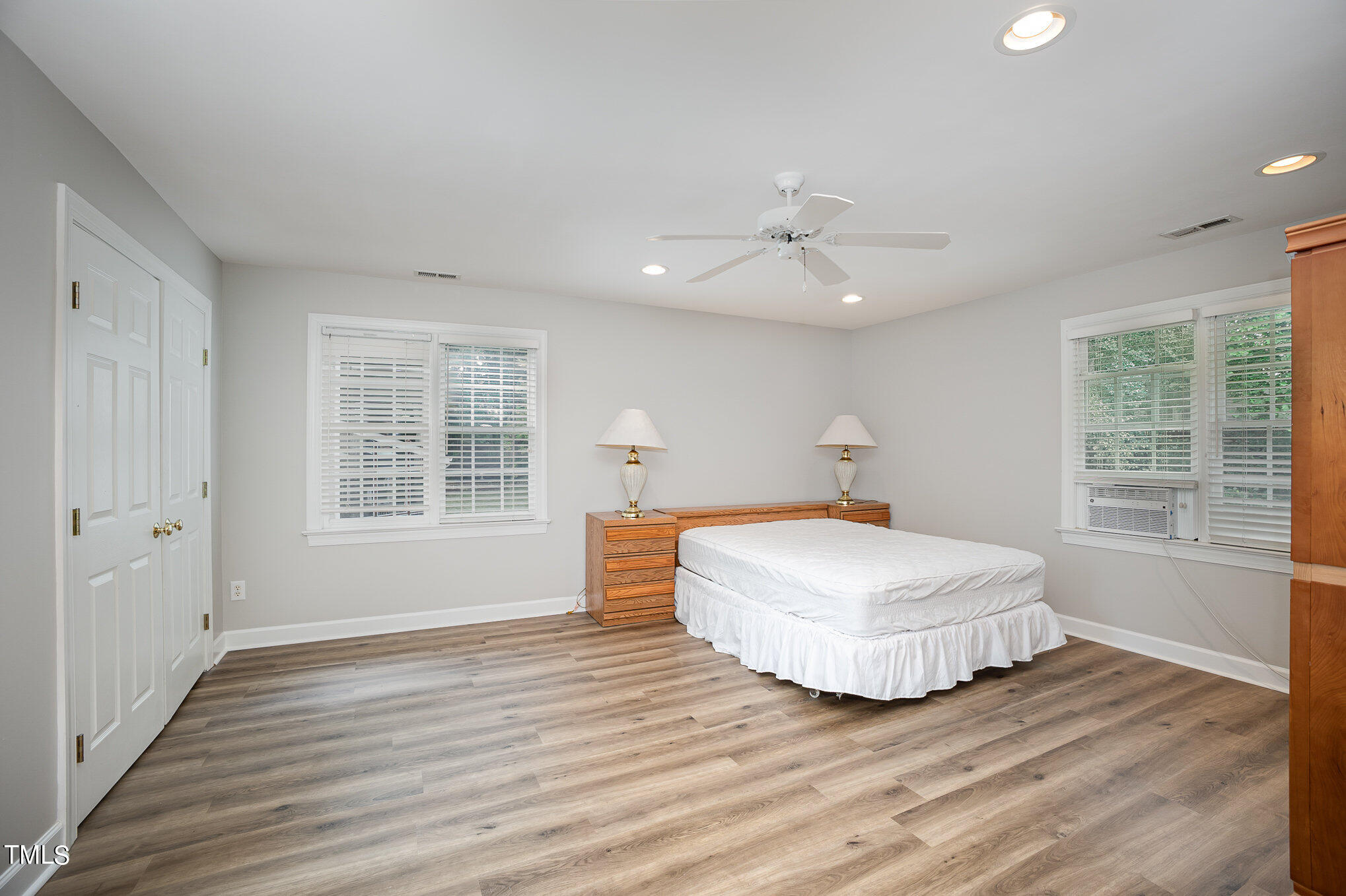 9400 Floral Ridge Court Raleigh, NC 27613 - Photo 24 of 35 a bedroom with a bed and window