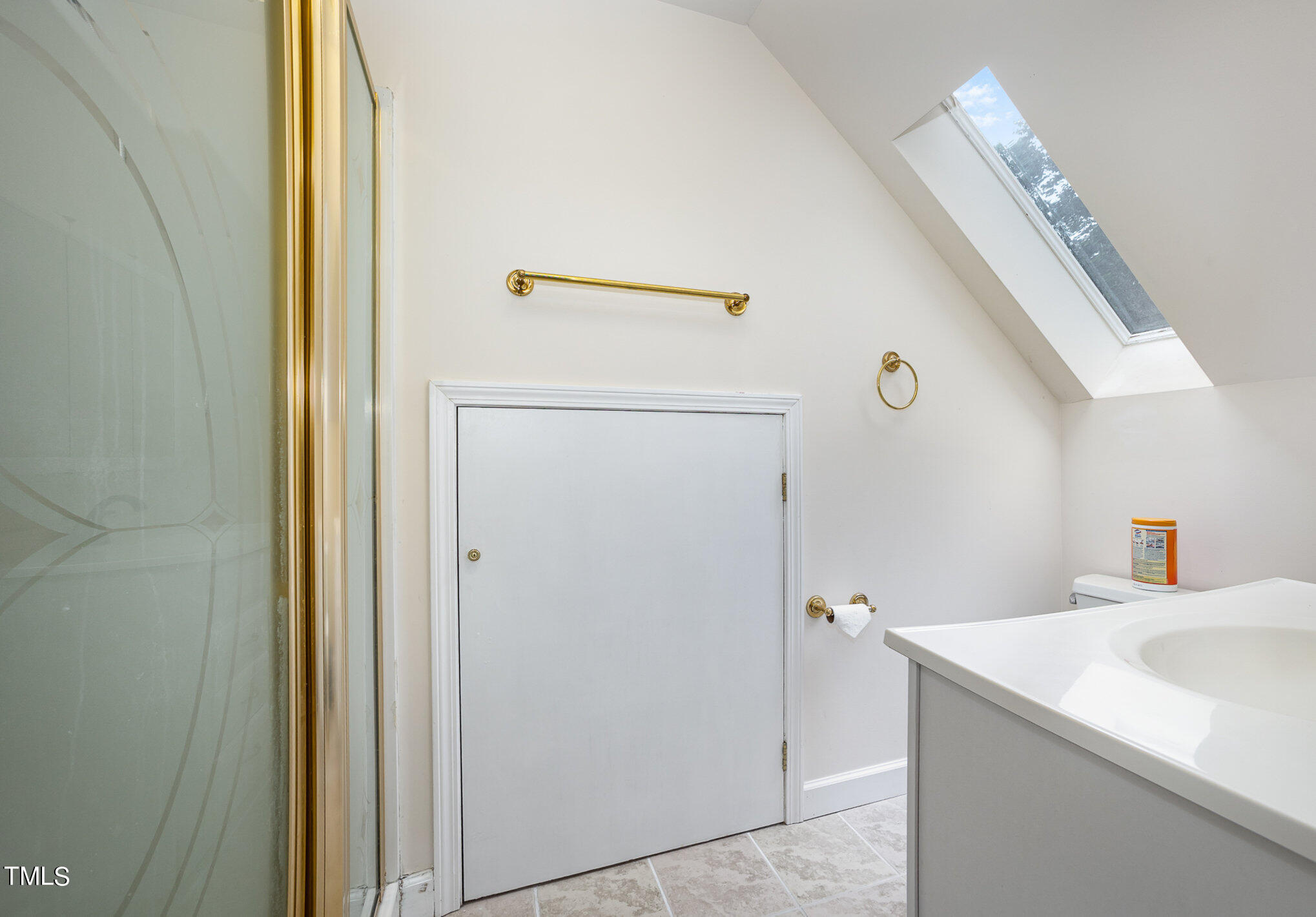 9400 Floral Ridge Court Raleigh, NC 27613 - Photo 30 of 35 a bathroom with a sink and a mirror