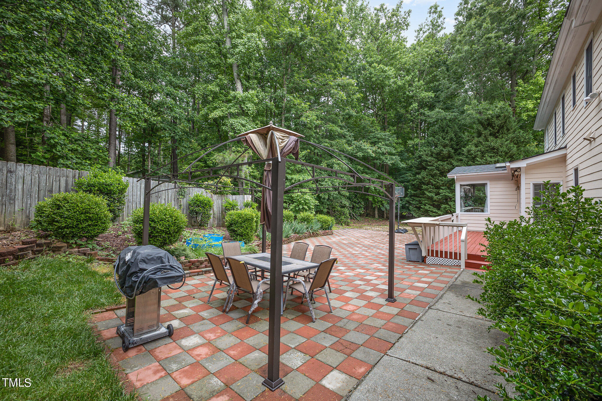 9400 Floral Ridge Court Raleigh, NC 27613 - Photo 34 of 35 a view of a backyard with sitting area