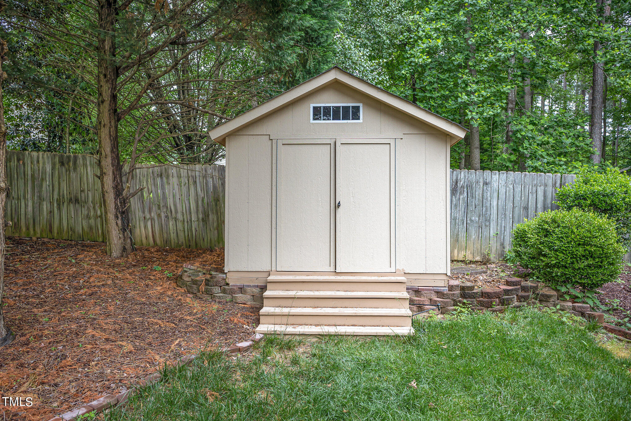 9400 Floral Ridge Court Raleigh, NC 27613 - Photo 35 of 35 a front view of a house with a garden