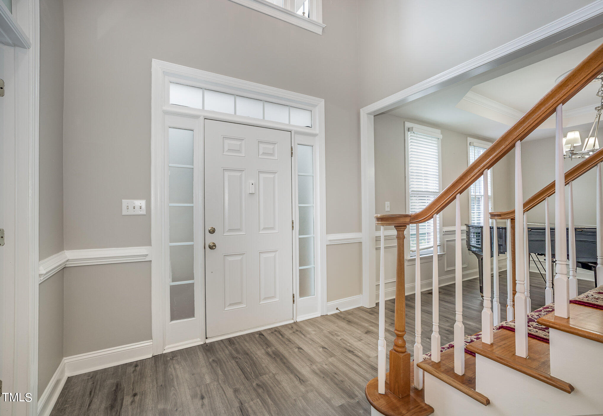 9400 Floral Ridge Court Raleigh, NC 27613 - Photo 5 of 35 wooden floor with windows and stairs