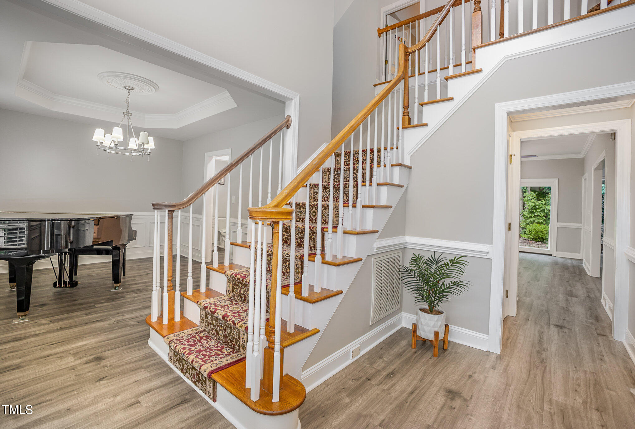 9400 Floral Ridge Court Raleigh, NC 27613 - Photo 6 of 35 a view of entryway and hall with wooden floor