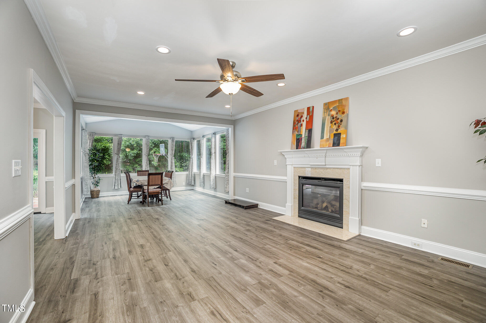 9400 Floral Ridge Court Raleigh, NC 27613 - Photo 7 of 35 a living room with furniture and a fireplace