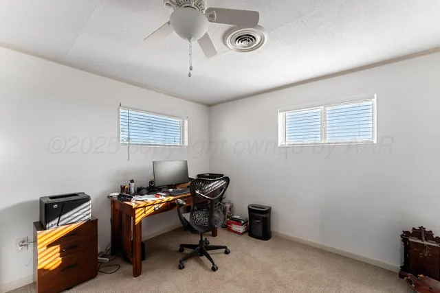 a room that has a bed and a table in it