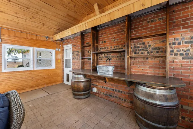 a view of small space with wooden floor and a window