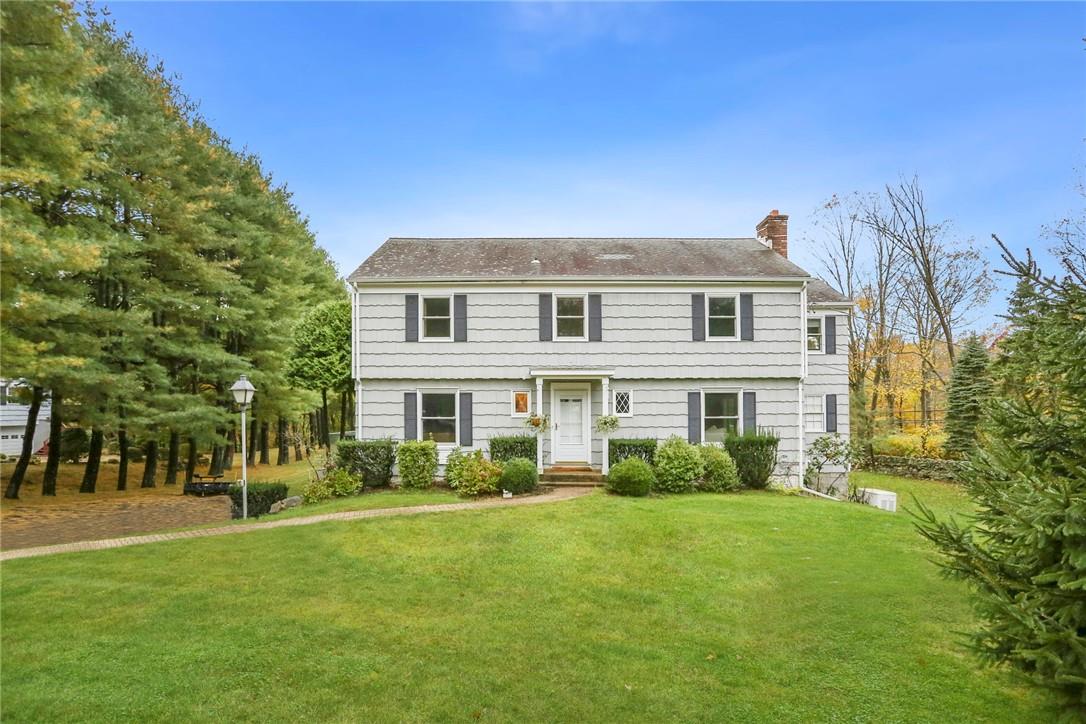 1 Lyons Road Armonk, NY 10504 - Photo 1 of 1 a front view of a house with a garden