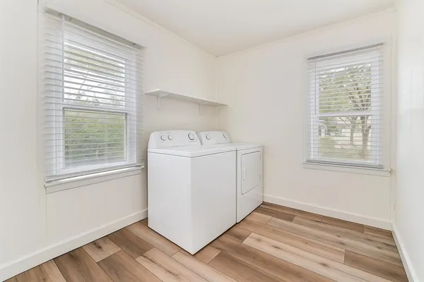 a utility room with closet dryer and washer
