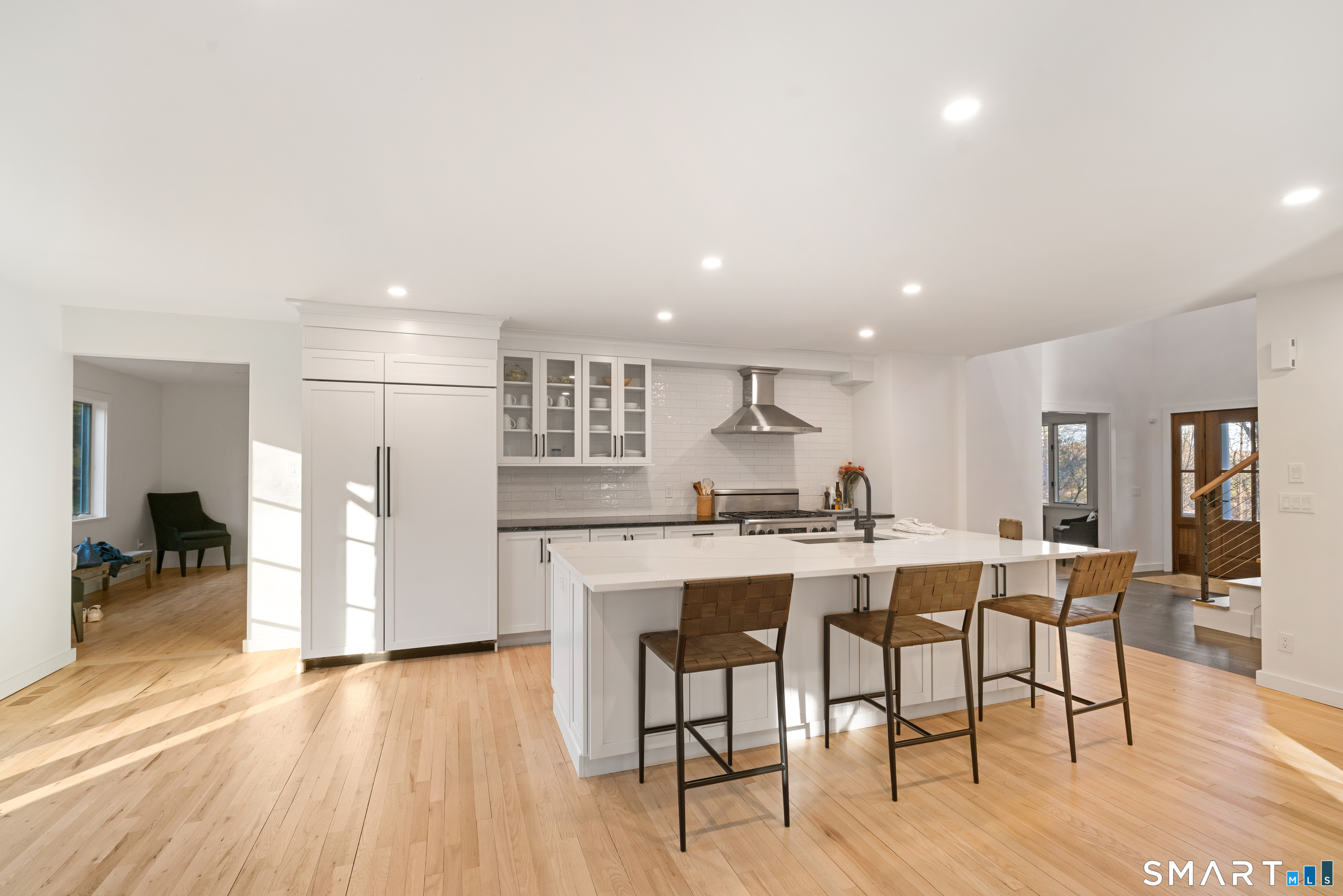 23 Norton Road Easton, CT 06612 - Photo 4 of 40 The beautifully renovated kitchen offers an oversize quartz island with plenty of seating.