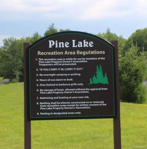 a view of a park with welcome board