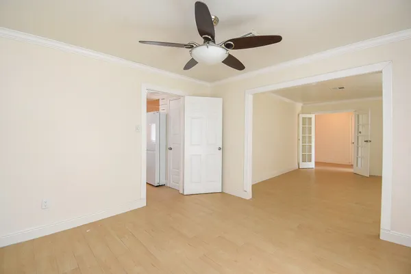 a kitchen with stainless steel appliances a refrigerator and a stove top oven