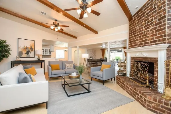 a kitchen with granite countertop a sink stainless steel appliances and cabinets