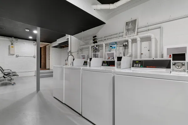 a kitchen with stainless steel appliances a sink and a refrigerator