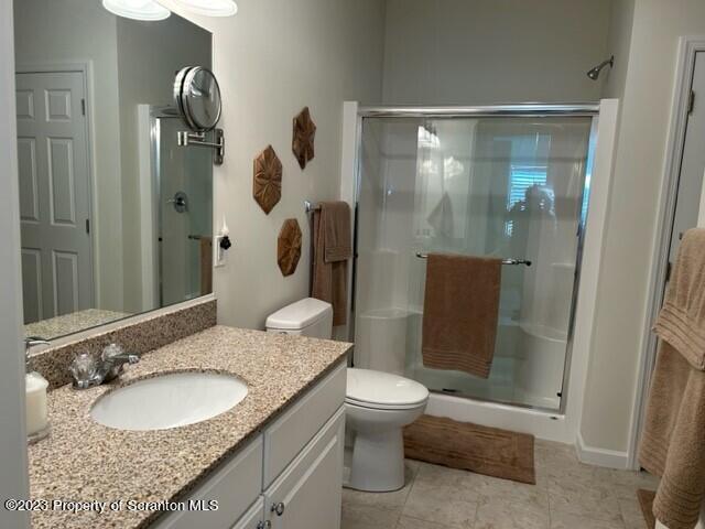 118 Wyndham Road Clarks Summit, PA 18411 - Photo 13 of 21 a bathroom with a granite countertop sink toilet and shower