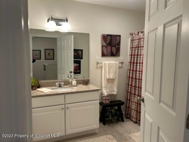 118 Wyndham Road Clarks Summit, PA 18411 - Photo 14 of 21 a bathroom with a sink a mirror and a shower