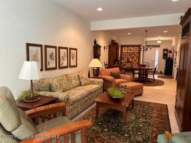 118 Wyndham Road Clarks Summit, PA 18411 - Photo 7 of 21 a living room with furniture and a wooden floor