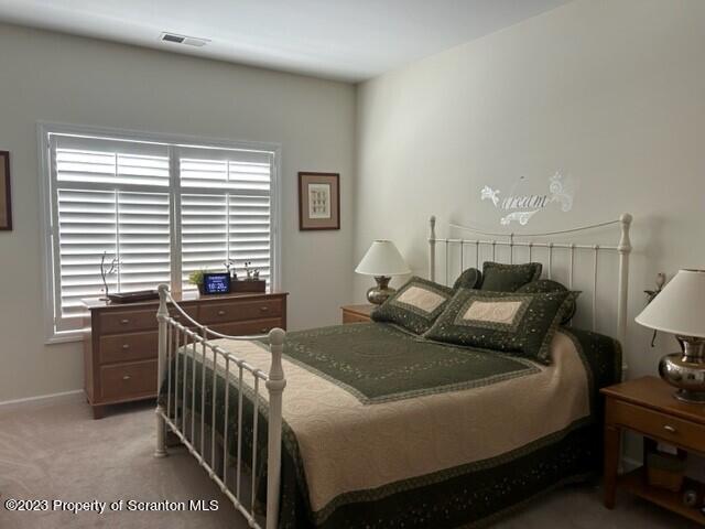 118 Wyndham Road Clarks Summit, PA 18411 - Photo 8 of 21 a bedroom with a bed and a window