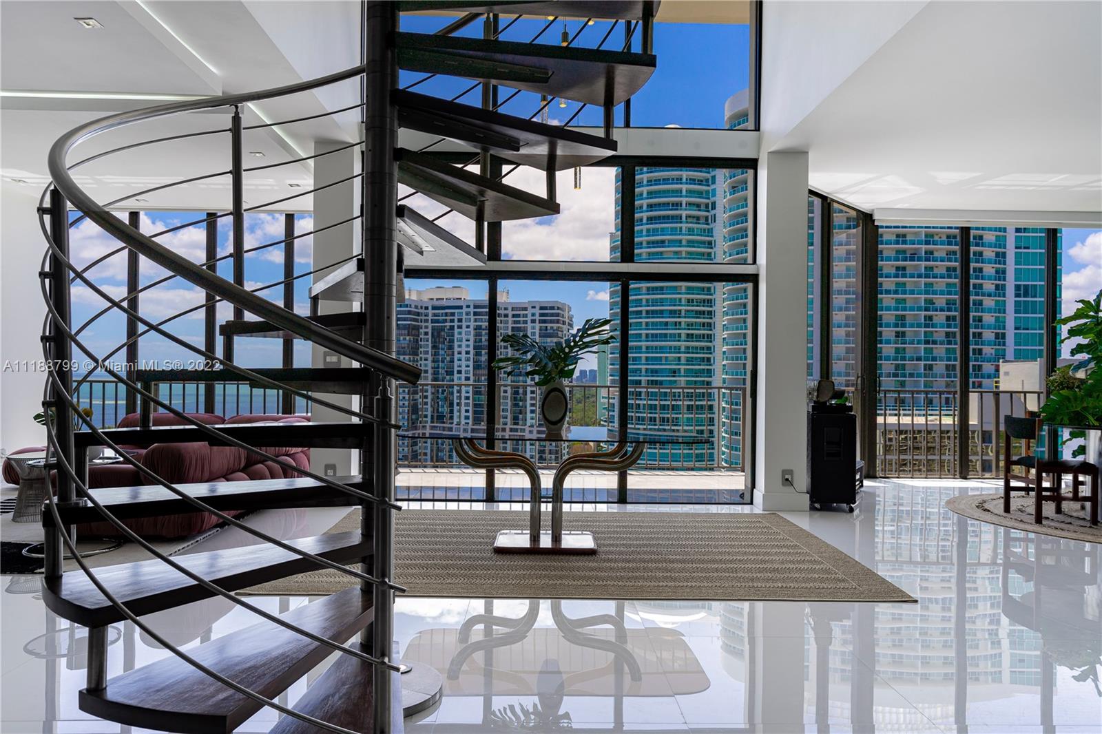 a view of a patio with table and chairs with wooden floor and fence