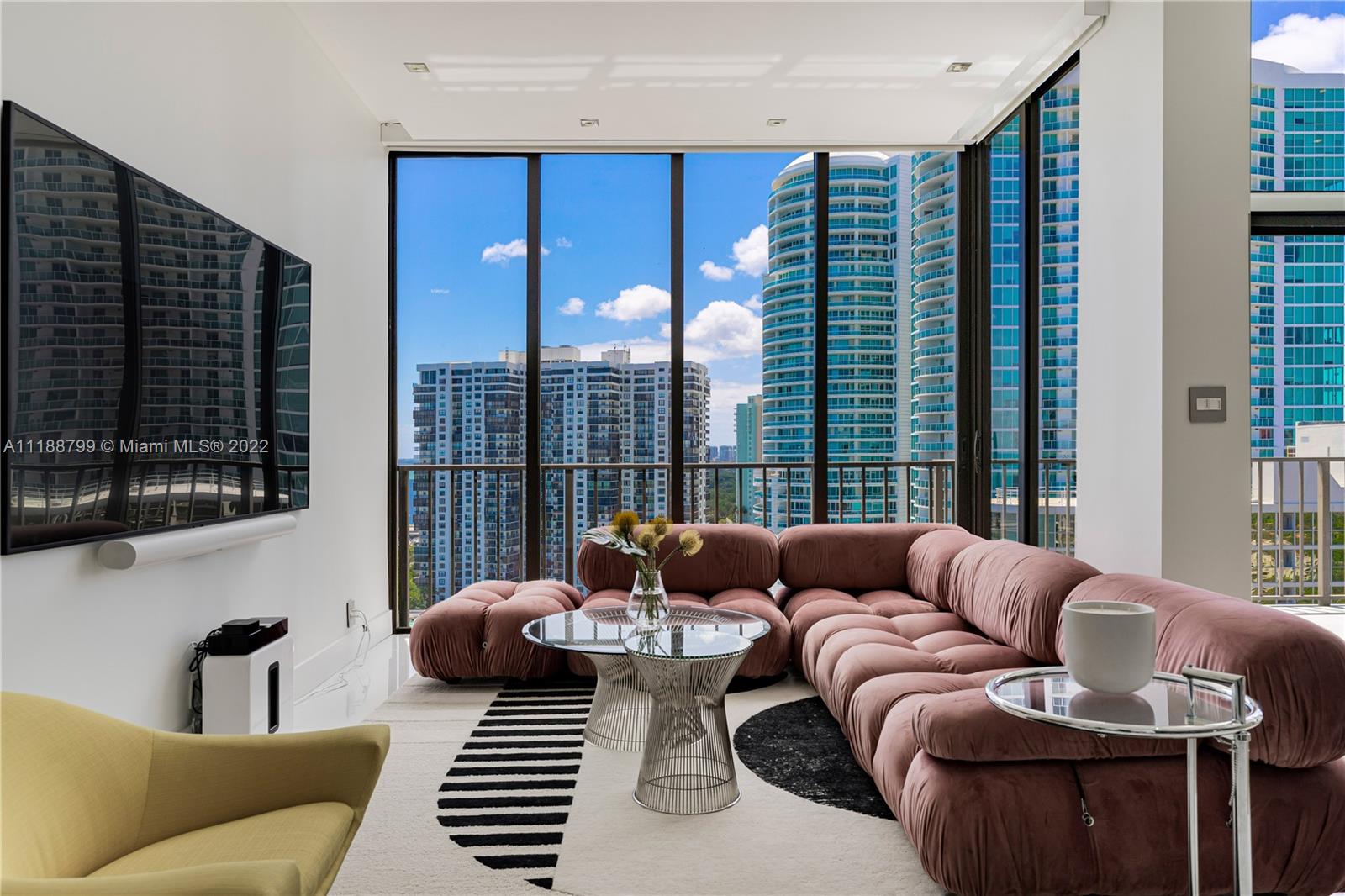 1925 Brickell Avenue, Unit DPH7 Miami, FL 33129 - Photo 13 of 37 a living room with furniture and a large window