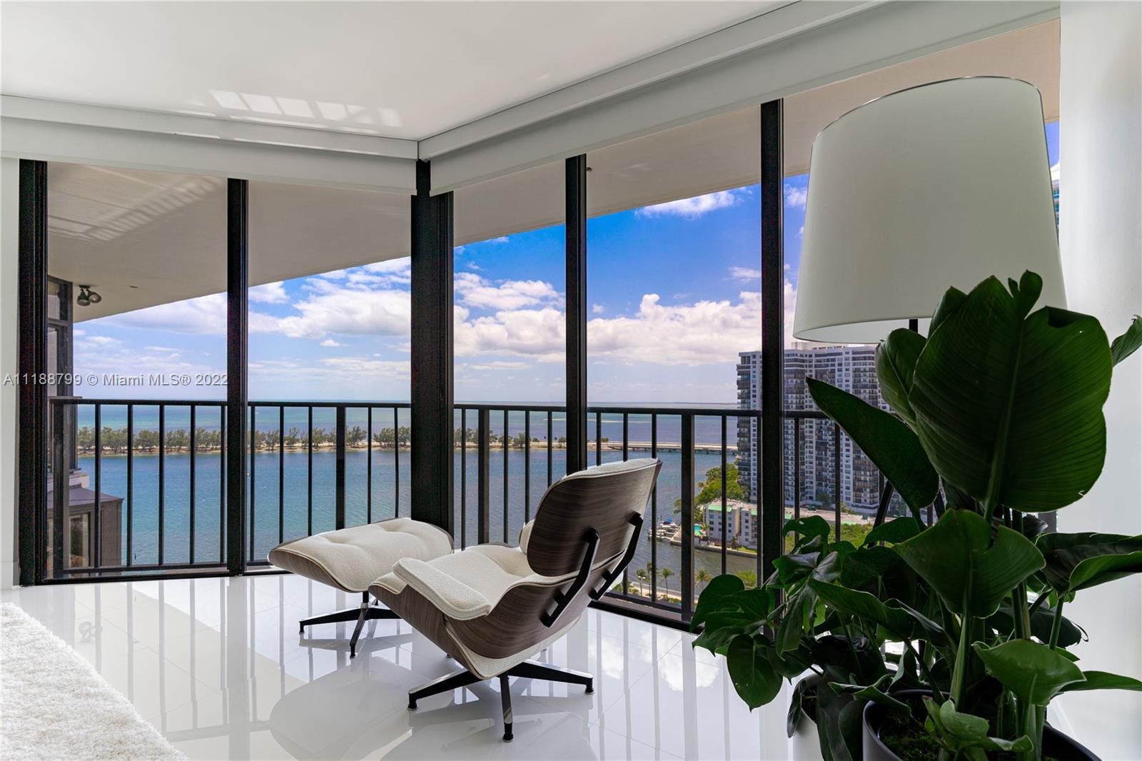 1925 Brickell Avenue, Unit DPH7 Miami, FL 33129 - Photo 22 of 37 a living room with furniture and a potted plant