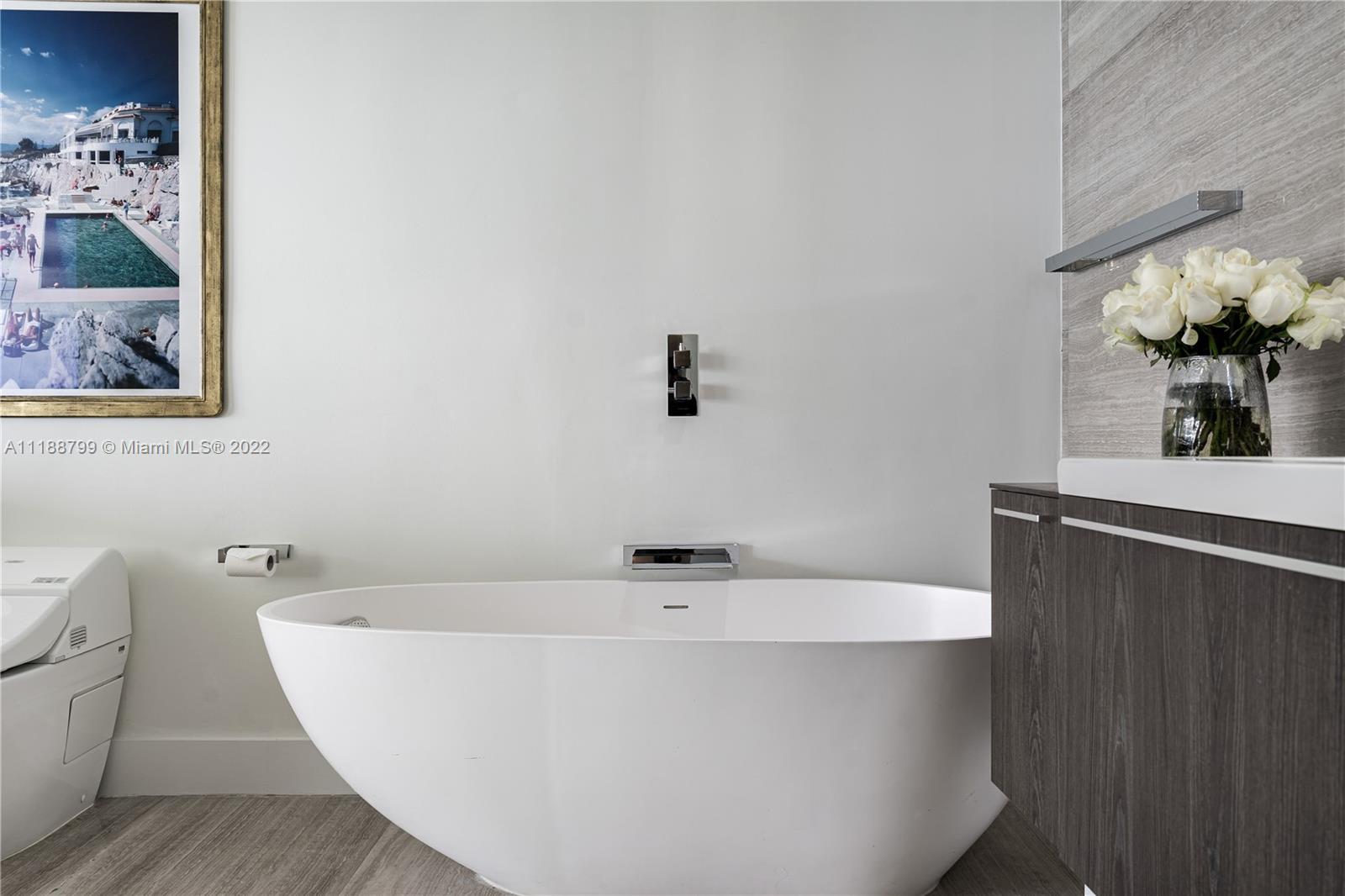 1925 Brickell Avenue, Unit DPH7 Miami, FL 33129 - Photo 25 of 37 a view of a bathtub in a bathroom