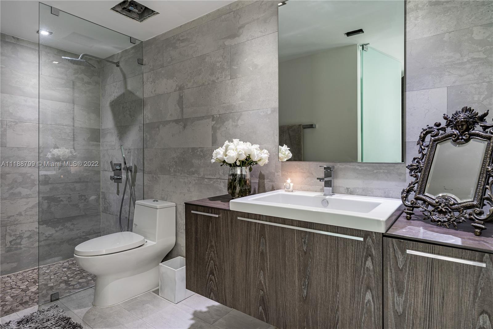 1925 Brickell Avenue, Unit DPH7 Miami, FL 33129 - Photo 27 of 37 a bathroom with a sink toilet and shower