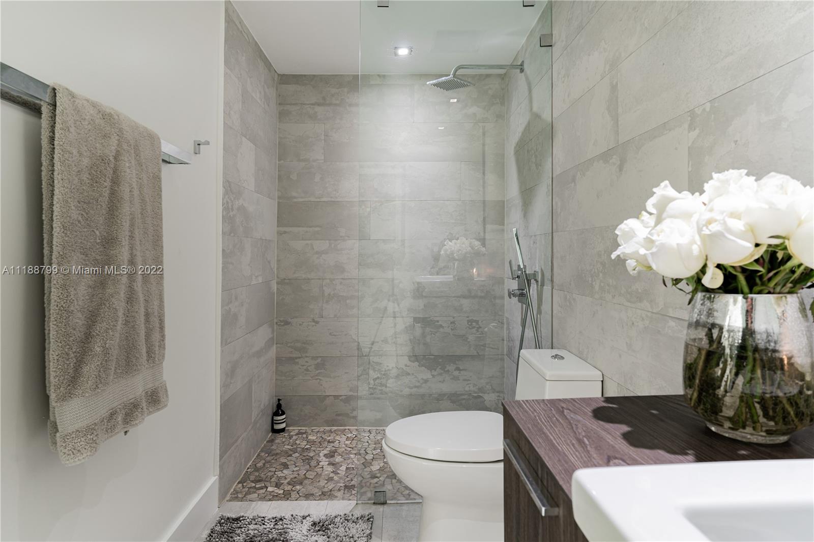 1925 Brickell Avenue, Unit DPH7 Miami, FL 33129 - Photo 28 of 37 a bathroom with a sink a toilet and shower