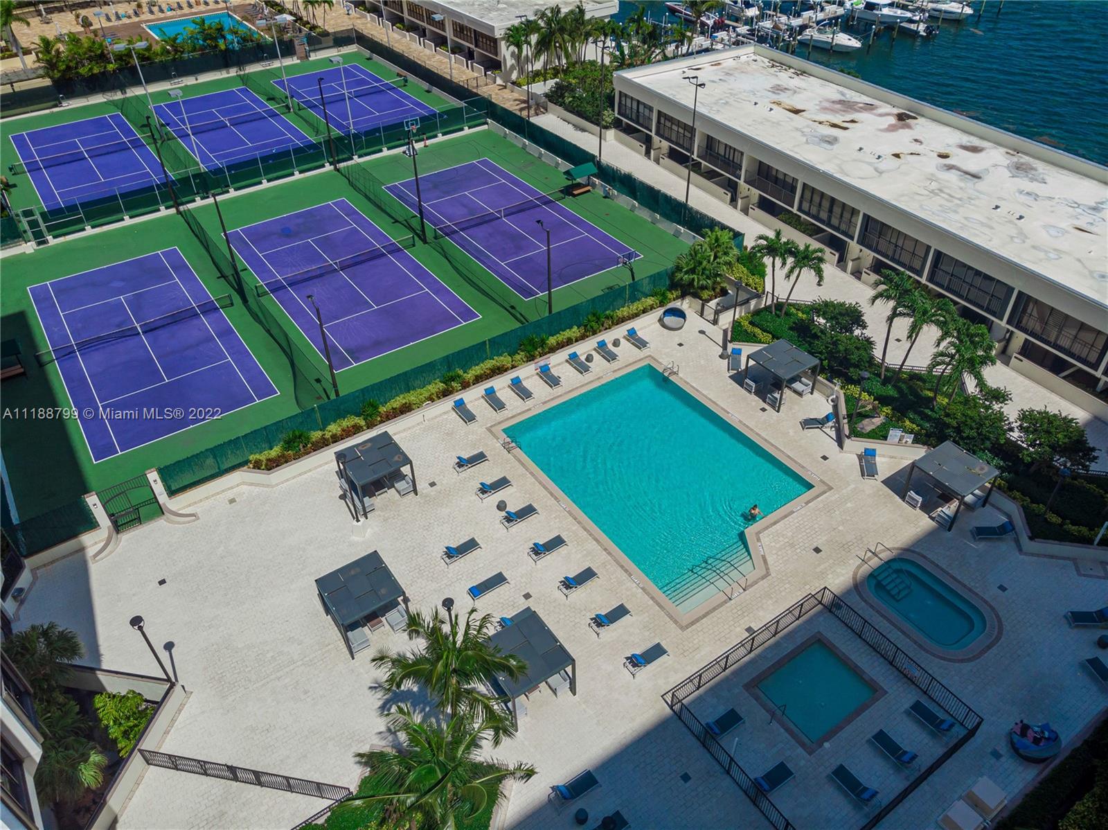 1925 Brickell Avenue, Unit DPH7 Miami, FL 33129 - Photo 34 of 37 an aerial view of a tennis ground and a yard