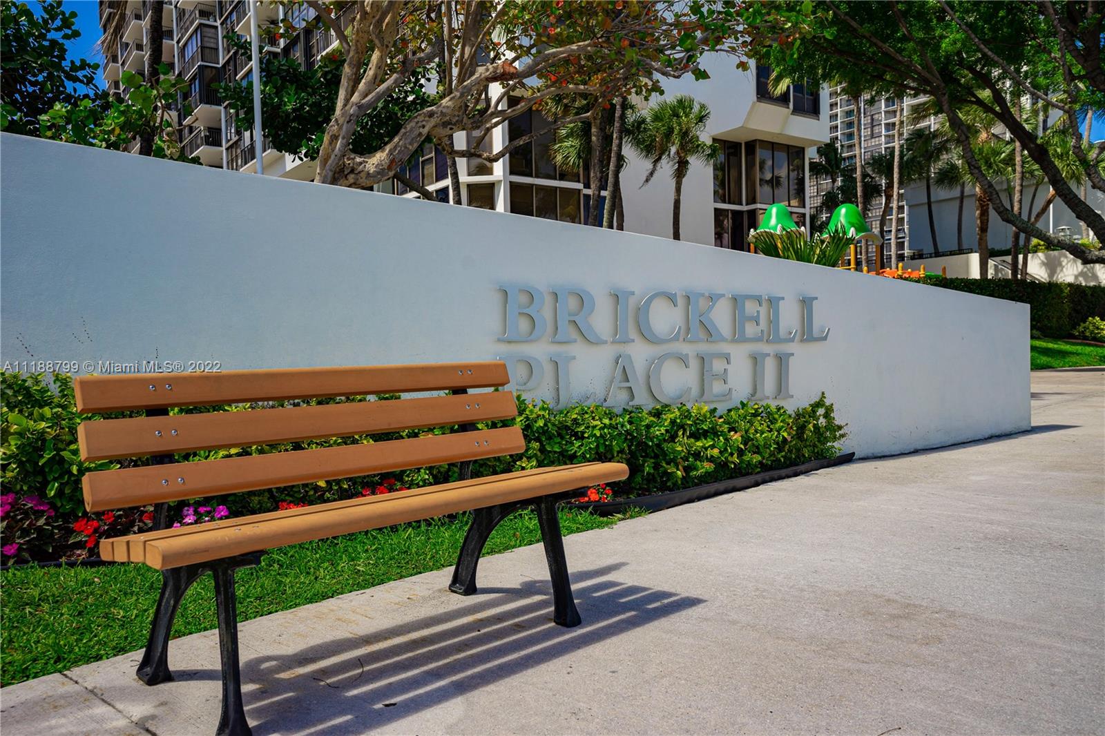 1925 Brickell Avenue, Unit DPH7 Miami, FL 33129 - Photo 37 of 37 a wooden bench sitting in front of a house