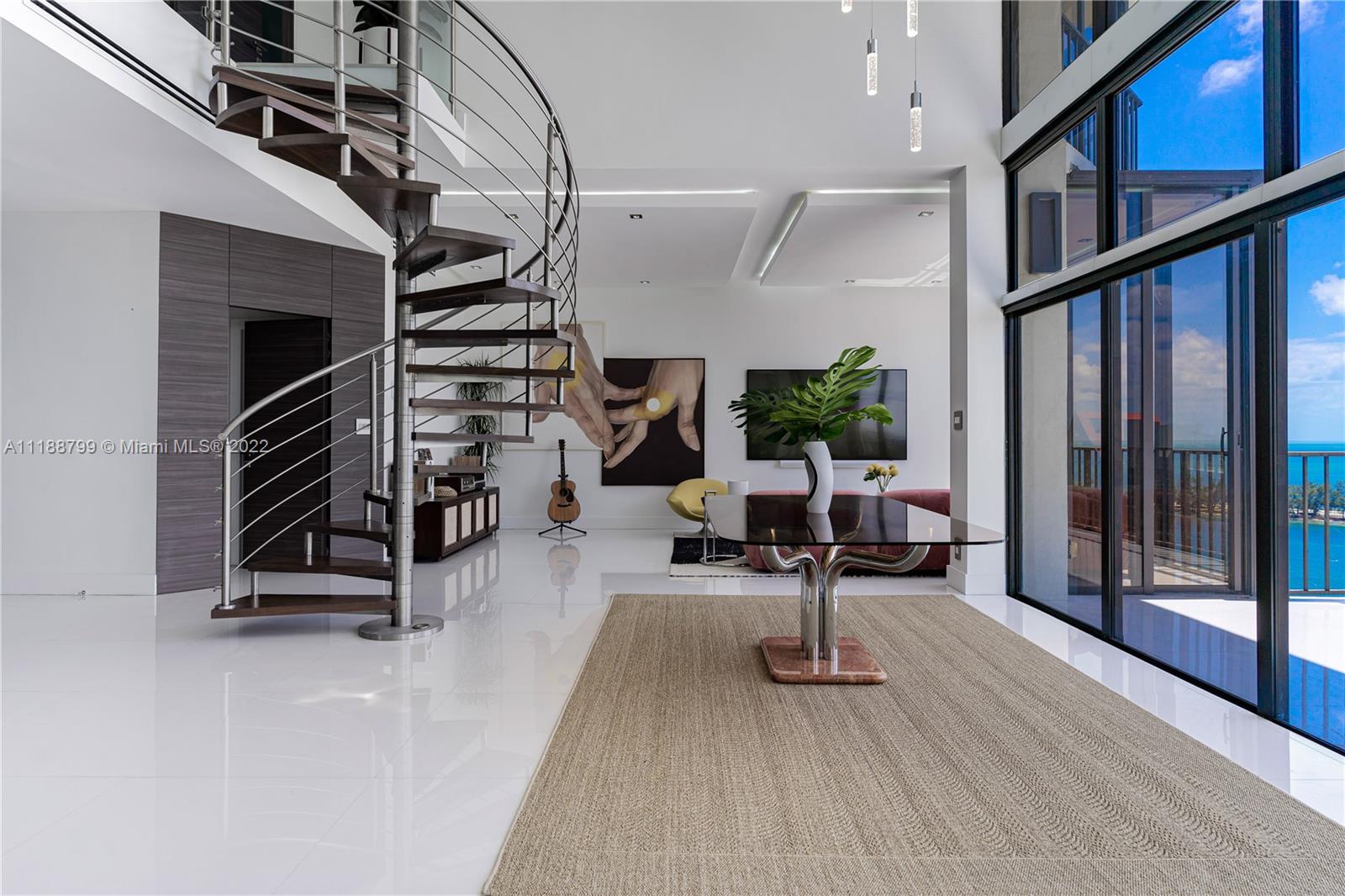 1925 Brickell Avenue, Unit DPH7 Miami, FL 33129 - Photo 4 of 37 a view of a living room with stairs and furniture