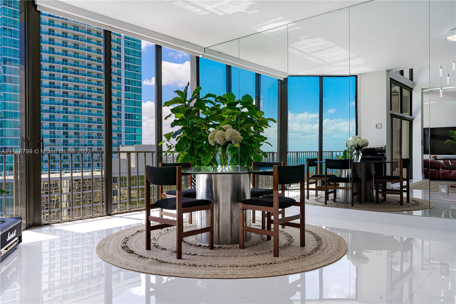 1925 Brickell Avenue, Unit DPH7 Miami, FL 33129 - Photo 5 of 37 a dining room with furniture and floor to ceiling window