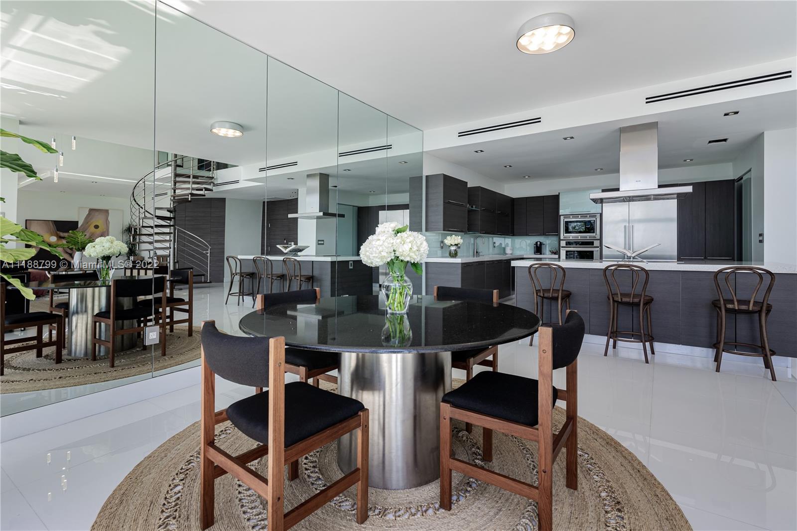 1925 Brickell Avenue, Unit DPH7 Miami, FL 33129 - Photo 6 of 37 a view of a dining room with furniture