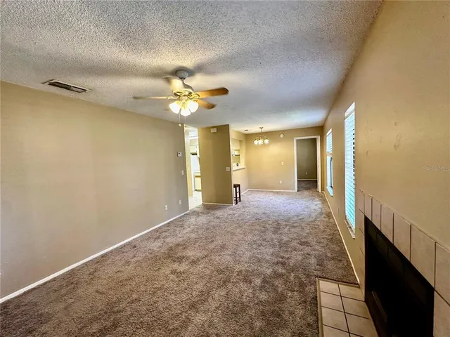 a view of a hallway with a chandelier