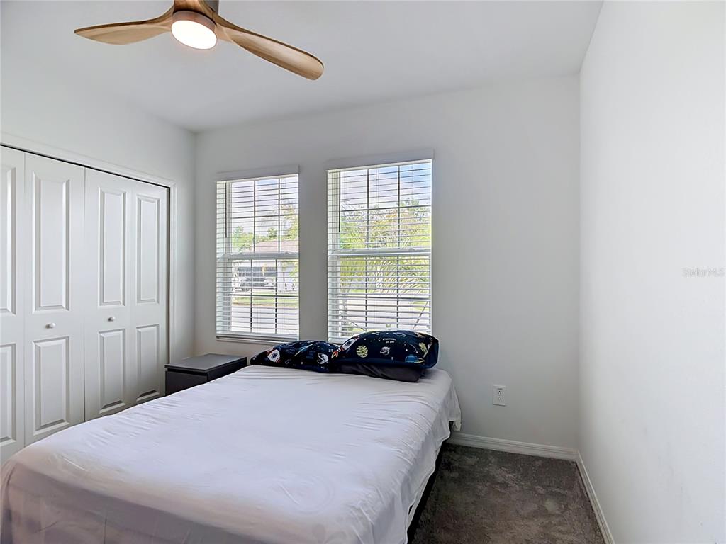 1633 Red Loop Lakeland, FL 33801 - Photo 16 of 60 a bedroom with a bed and a window
