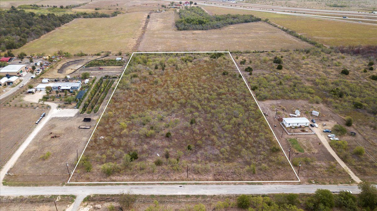 Tbd Ranchero Drive Buda, TX 78610 - Photo 1 of 10 Aerial view of sparsely populated area with property boundaries highlighted