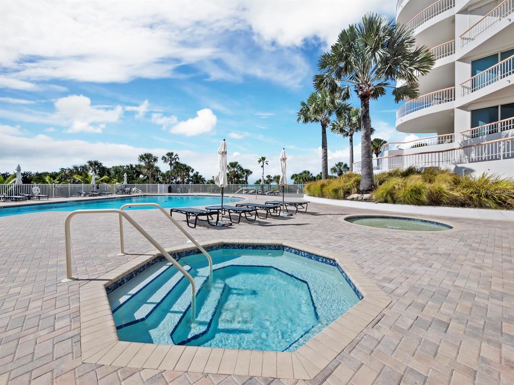455 Longboat Club Road, Unit 402 Longboat Key, FL 34228 - Photo 33 of 48 a view of outdoor space with swimming pool and seating