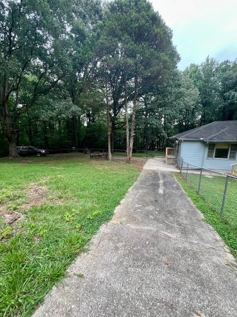 660 Hickory 3 Contiguous Trail Southeast Mableton, GA 30126 - Photo 8 of 35 a view of a backyard with a large tree