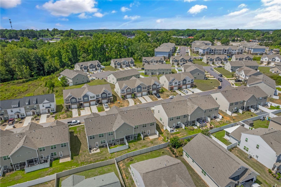 432 Bee Cv Way Pendleton, SC 29670 - Photo 36 of 39 An aerial perspective reveals a vibrant neighborhood filled with modern homes and lush green surroundings.
